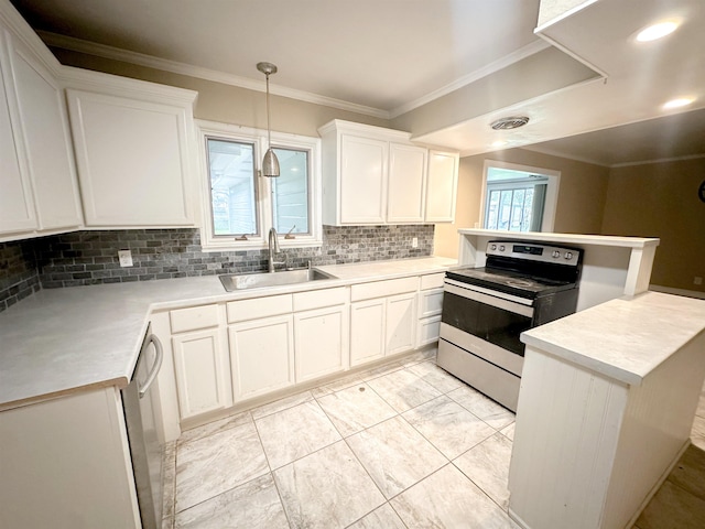 4438 W Edgar Ave, Orange, TX 77630 - kitchen with electric range oven, a peninsula, backsplash, light countertops, and white cabinetry
