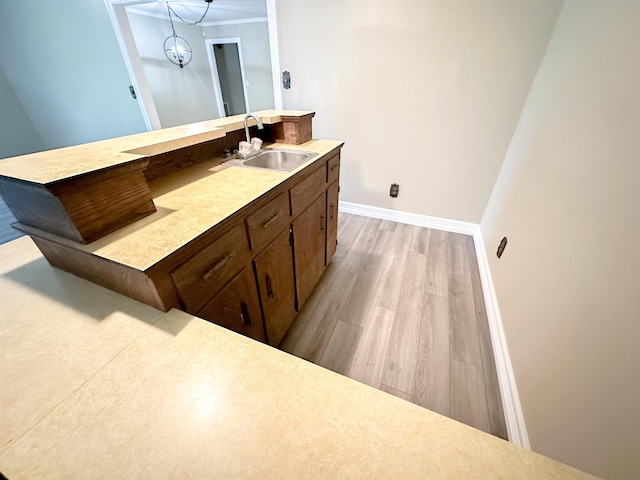 4438 W Edgar Ave, Orange, TX 77630 - bathroom featuring wood finished floors, vanity, and ornamental molding