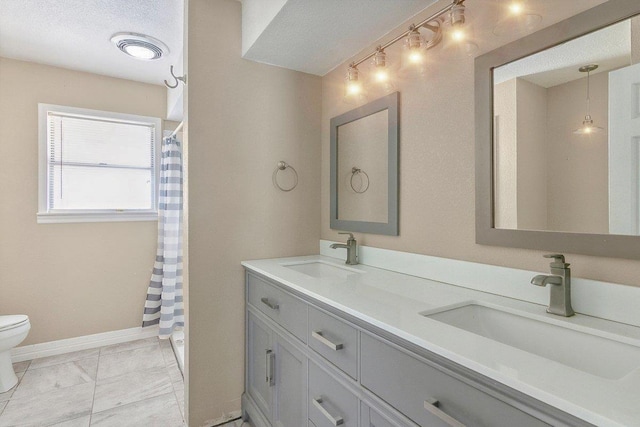 4438 W Edgar Ave, Orange, TX 77630 - bathroom featuring double vanity, a shower with curtain, and marble look tile flooring
