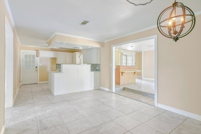 4438 W Edgar Ave, Orange, TX 77630 - unfurnished living room with ornamental molding, light tile patterned floors, and a chandelier