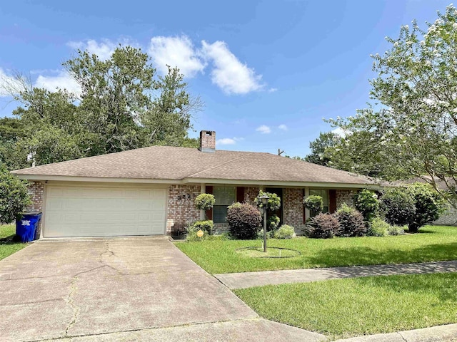 single story home featuring a front lawn and a garage