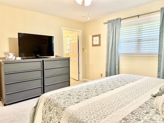 bedroom featuring light carpet