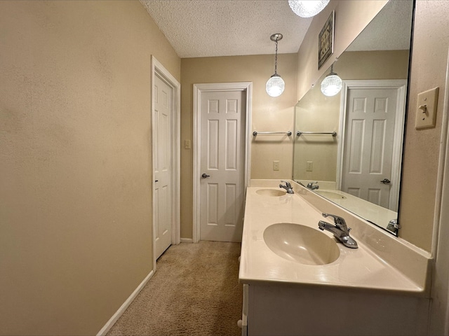 bathroom featuring vanity and a textured ceiling