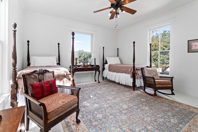 bedroom featuring ceiling fan and crown molding