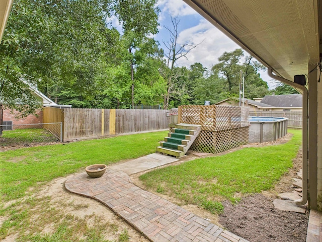 7090 Carroll Ln, Beaumont, TX 77713 - fenced backyard with a fire pit