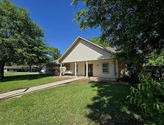 7090 Carroll Ln, Beaumont, TX 77713 - view of front of property featuring a front yard and covered porch