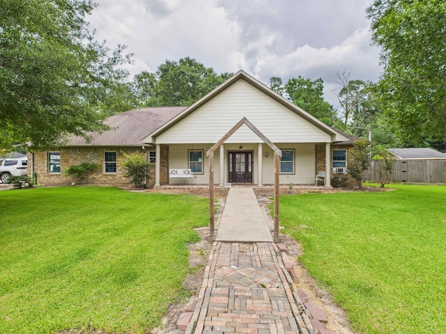 7090 Carroll Ln, Beaumont, TX 77713 - view of front of home with a front yard and covered porch