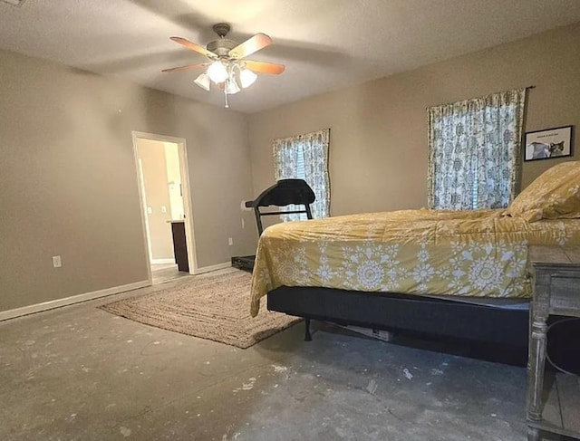 7090 Carroll Ln, Beaumont, TX 77713 - bedroom with unfinished concrete flooring, baseboards, and ceiling fan