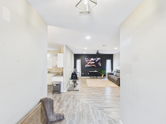 7090 Carroll Ln, Beaumont, TX 77713 - hall with light wood-type flooring and recessed lighting
