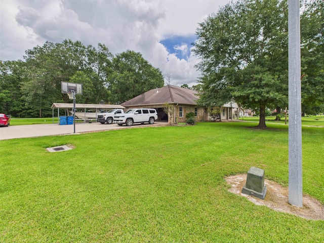 7090 Carroll Ln, Beaumont, TX 77713 - view of grassy yard with driveway