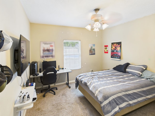 7090 Carroll Ln, Beaumont, TX 77713 - carpeted bedroom featuring a desk and ceiling fan