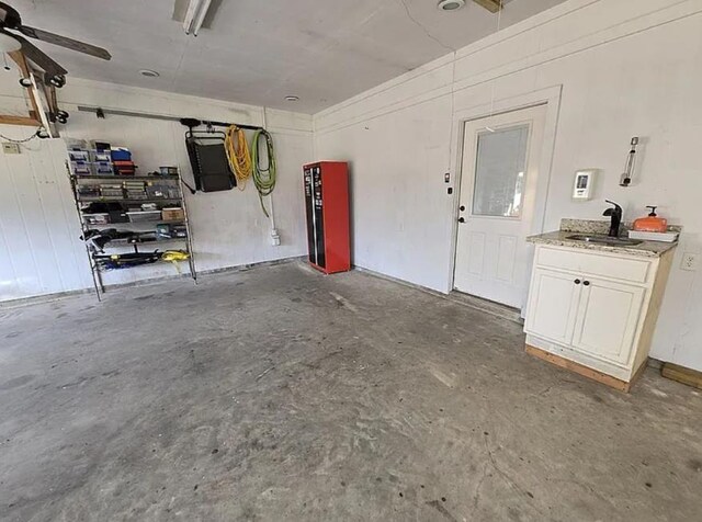 7090 Carroll Ln, Beaumont, TX 77713 - garage featuring a sink and a ceiling fan