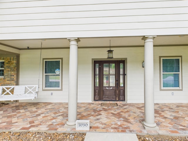 7090 Carroll Ln, Beaumont, TX 77713 - doorway to property with covered porch