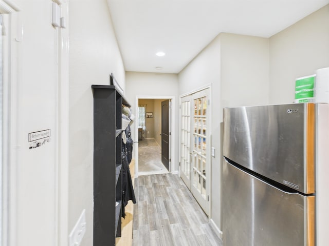 7090 Carroll Ln, Beaumont, TX 77713 - kitchen featuring freestanding refrigerator, light wood-style flooring, and recessed lighting