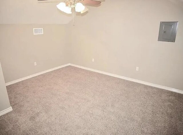 7090 Carroll Ln, Beaumont, TX 77713 - unfurnished room featuring ceiling fan, electric panel, carpet flooring, and baseboards
