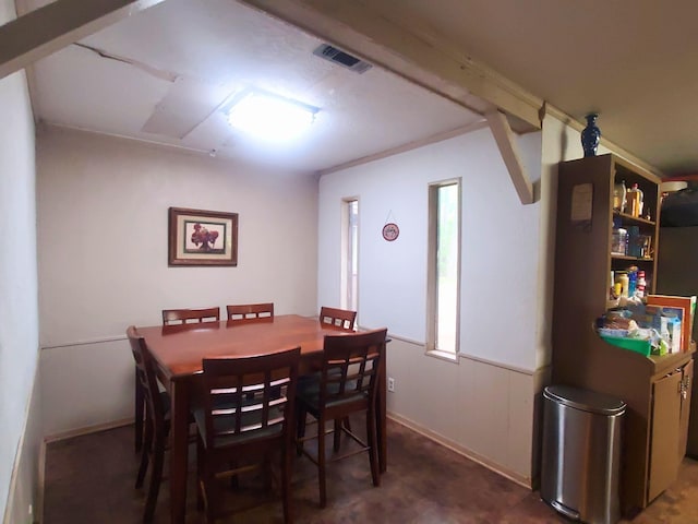 dining room featuring visible vents