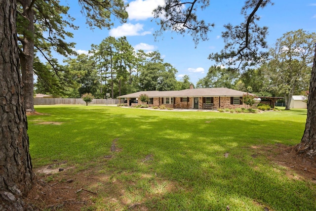 4169 Leatherwood Dr, Kountze, TX 77625 - back of property featuring brick siding