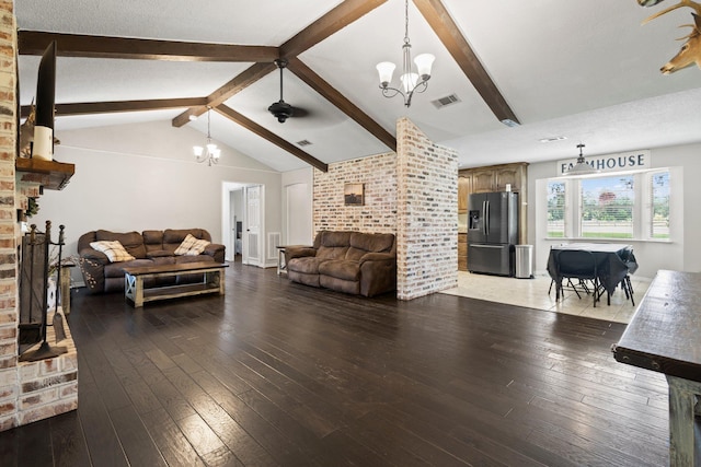 4169 Leatherwood Dr, Kountze, TX 77625 - living area with a chandelier, hardwood / wood-style flooring, and a brick fireplace