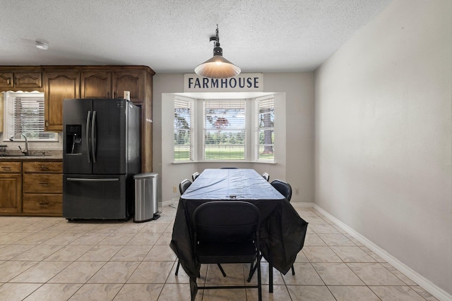 4169 Leatherwood Dr, Kountze, TX 77625 - dining space with healthy amount of natural light and a textured ceiling