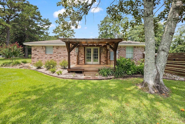 4169 Leatherwood Dr, Kountze, TX 77625 - ranch-style home with french doors, brick siding, and a pergola