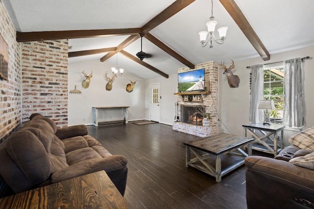 4169 Leatherwood Dr, Kountze, TX 77625 - living area featuring a fireplace, a chandelier, and wood-type flooring