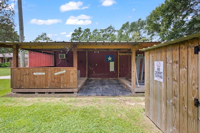 4169 Leatherwood Dr, Kountze, TX 77625 - rear view of property featuring a lawn