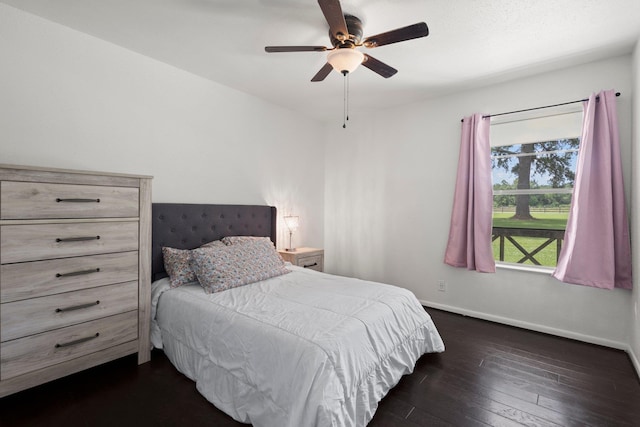 4169 Leatherwood Dr, Kountze, TX 77625 - bedroom featuring dark wood-style floors and ceiling fan