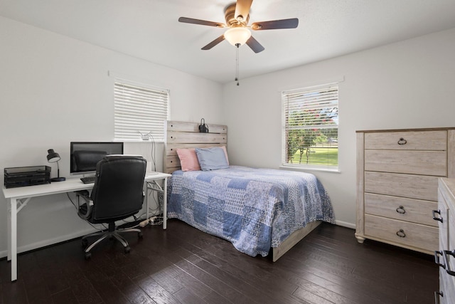 4169 Leatherwood Dr, Kountze, TX 77625 - bedroom featuring dark wood-style flooring, ceiling fan, and a desk