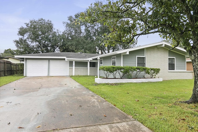 ranch-style home with a front yard and a garage