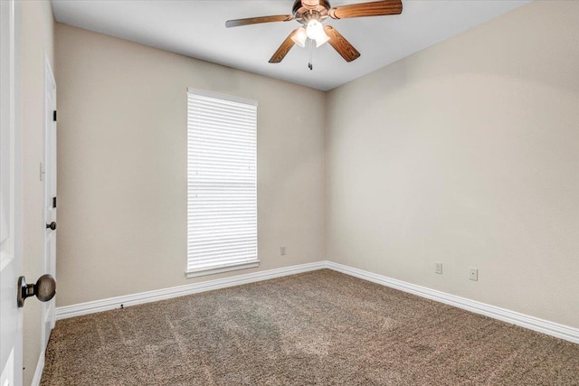 empty room with carpet and ceiling fan