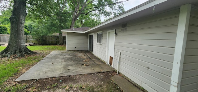 view of property exterior with a patio