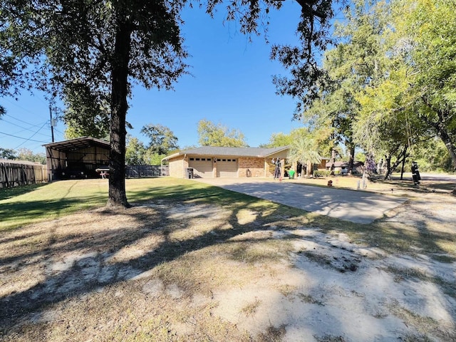 exterior space featuring a front yard and a carport