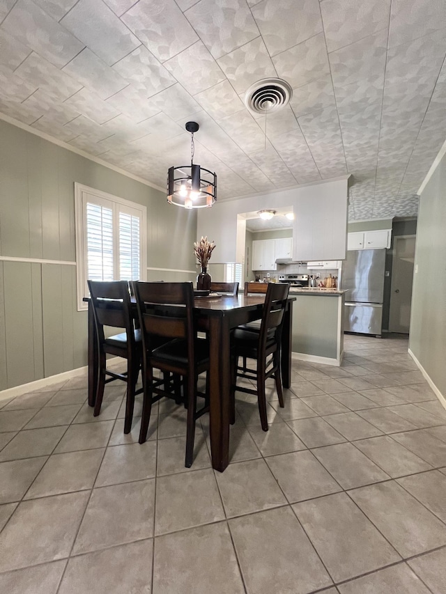 tiled dining area with ornamental molding