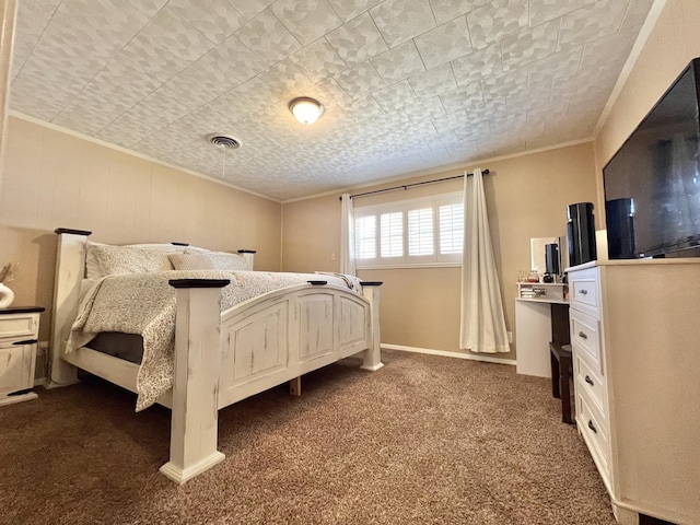 bedroom with dark carpet and ornamental molding