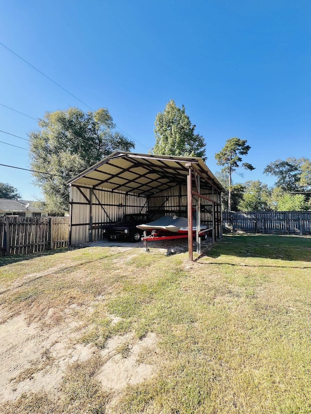 view of parking featuring a carport and a yard