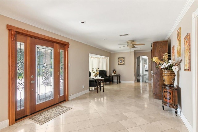 entryway featuring ceiling fan, ornamental molding, and light tile patterned floors