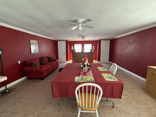 dining space with a textured ceiling, ceiling fan, and ornamental molding