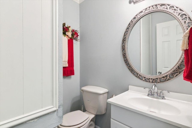 bathroom featuring vanity and toilet