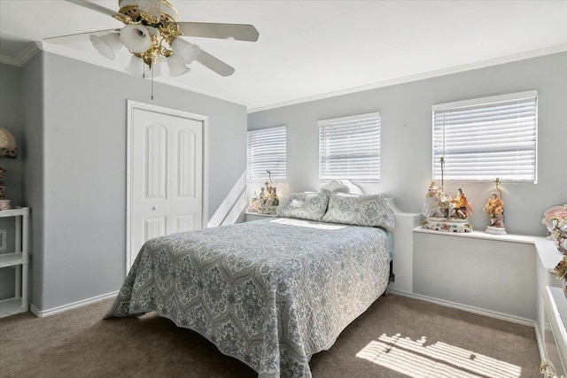 carpeted bedroom featuring ceiling fan, a closet, and ornamental molding