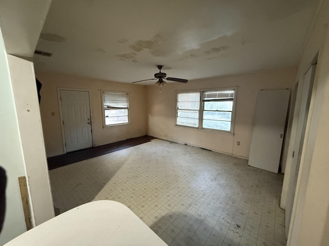 entrance foyer featuring ceiling fan and a healthy amount of sunlight