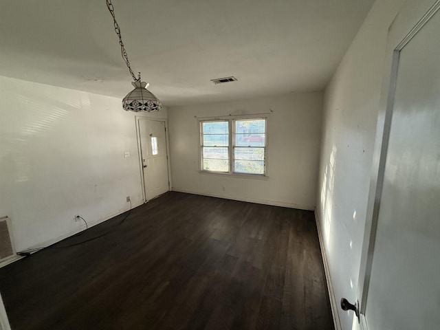 spare room featuring dark hardwood / wood-style floors