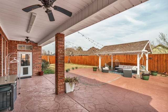 view of patio with an outdoor living space and ceiling fan