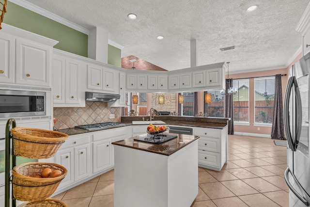 kitchen with white cabinetry, light tile patterned floors, ventilation hood, a kitchen island, and appliances with stainless steel finishes