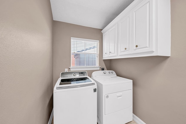 washroom with cabinets and separate washer and dryer