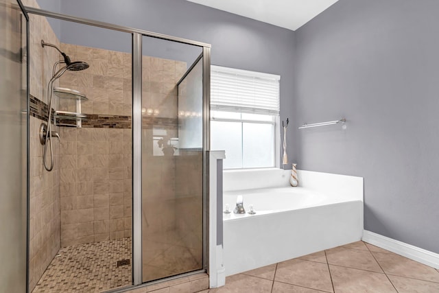 bathroom with tile patterned flooring and independent shower and bath