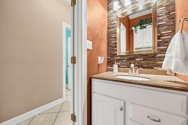 bathroom with tile patterned floors, vanity, and tasteful backsplash