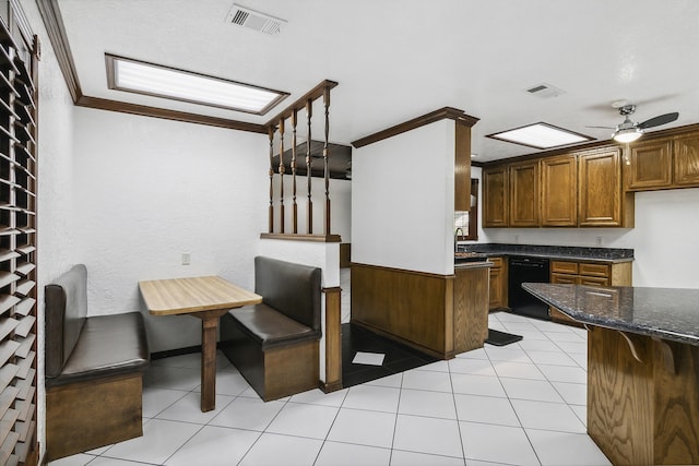 kitchen with dishwasher, ceiling fan, ornamental molding, and light tile patterned floors