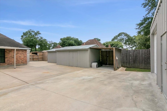 view of patio / terrace featuring a storage shed