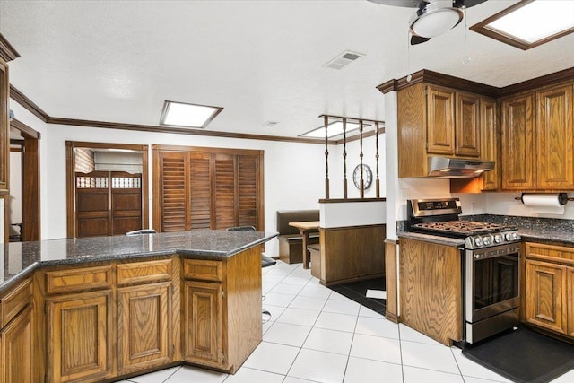 kitchen with crown molding, stainless steel gas stove, ceiling fan, light tile patterned floors, and kitchen peninsula