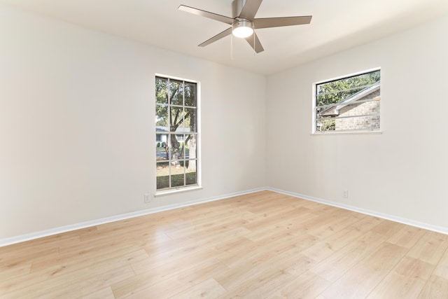 empty room featuring ceiling fan and light hardwood / wood-style floors